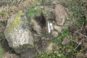 Partly embedded stone upturned